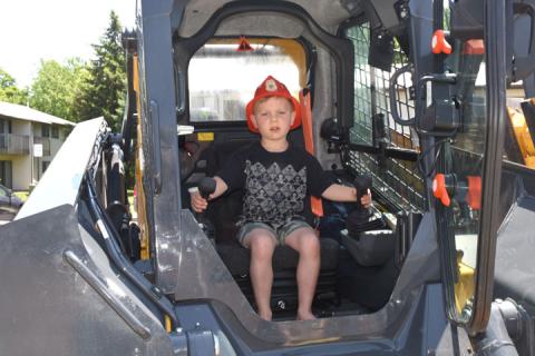 Tyler Shaw on the village skid loader