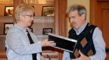 Sally Siferd presents plaque to Robert Neff