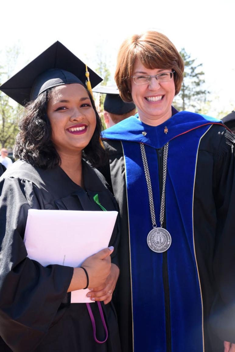 2019 Bluffton University graduate Alicia Loch, a biology and sociology double major from Quakertown, Pa., poses with President Jane M. Wood following Bluffton’s 119th Commencement ceremony.
