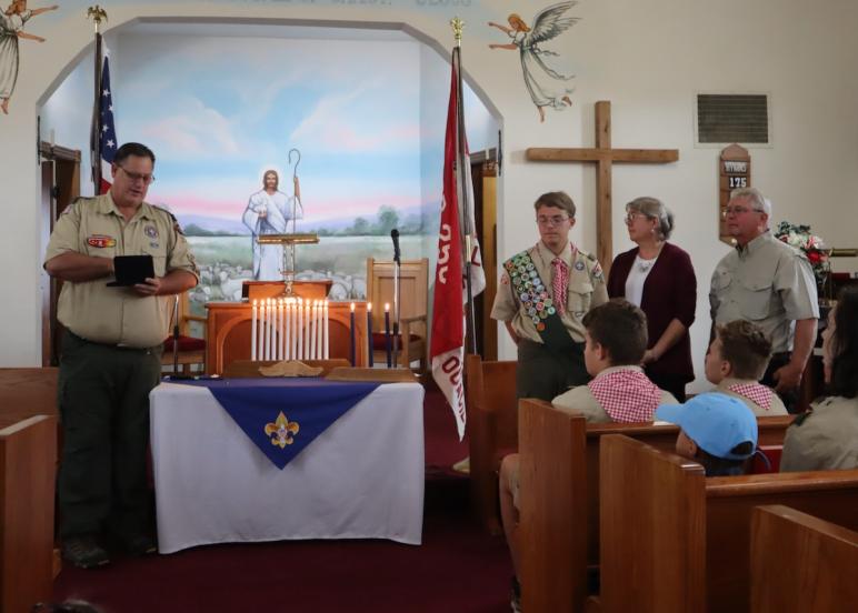 Troop leader Mike Metzger explains Eagle Scout pin ceremony