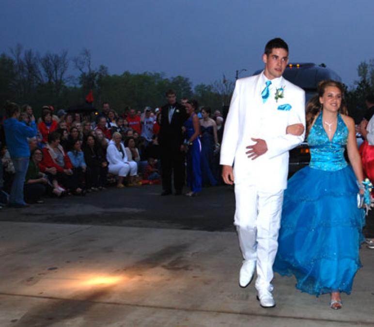 A white sport coat and almost a pink carnation