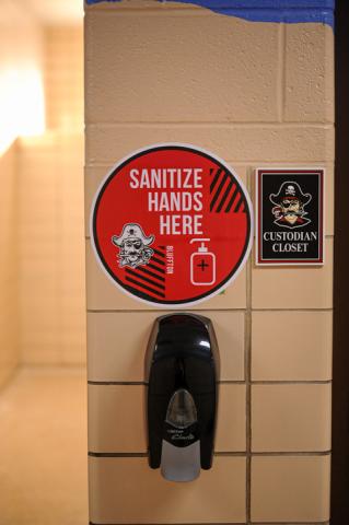 Sanitize hands here