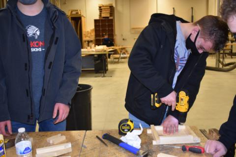 Bluffton student Elijah Evans builds a birdhouse in Carpentry.
