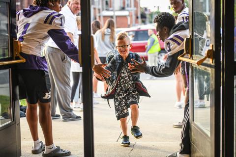 A double row of high fives at Bluffton Elementary School