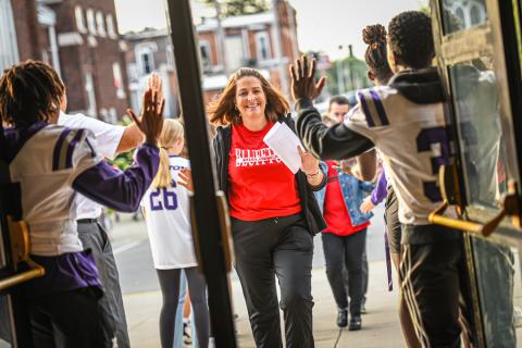 Mrs. Parker (third grade teacher) joins in the fun of High-Five Friday
