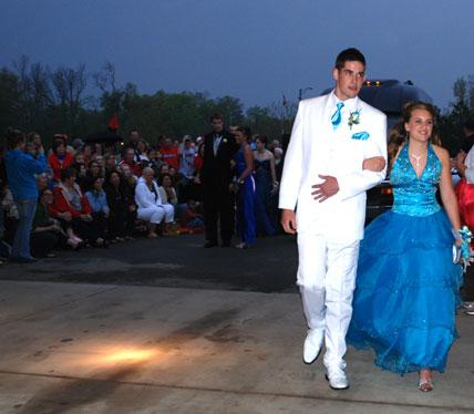 A white sport coat and almost a pink carnation