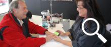 Joan Fredericks gives a manicure to  Jeff Boehr, owner of the building housing Polished Nail and Body Salon