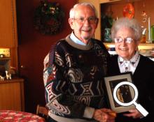 Luther and Geneva Shetler hold their wedding photo from 70 years ago
