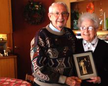 Luther and Geneva Shetler hold their wedding photo from 70 years ago