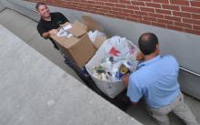 Barry Schneck and Dan Wolfe transport donated food to the Bluffton Food Pantry