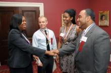 UFT Vice President for Elementary Schools Karen Alford (left) congratulates Manhattan winners (from second left) Matthew Schweingruber of PS 128 and Melissa White and Dwain Newell of PS 169.