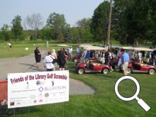 Golfers receive instructions before the golf scramble