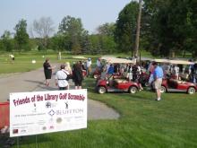 Golfers receive instructions before the golf scramble