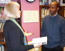 Kgosi Mafoko, chief of the village of Pitseng, Botswana, talks with Louise Matthews, director of Bluffton University^aEURTMs Lion and Lamb Peace Arts Center, during a tour of the center. Mafoko traveled to Bluffton with Nthati Phetlhu, a language and culture instructor who worked with Bluffton students who visited Pitseng for cross-cultural experiences in 2007 and 2009. Another group of 10 Bluffton students is going there this May.