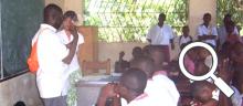 Katie Basinger is talking to young Haitians via an interpreter at one of the Mission Possible schools. Click on image to enlarge.