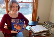 Lisa Weaver Dyck holds her latest book