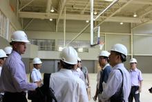 Kevin Nickel (left), Bluffton University^aEURTMs vice president for fiscal affairs, talks to members of a visiting delegation from China West Normal University during a tour of Bluffton^aEURTMs new Sommer Center for Health and Fitness Education. The 60,000-square-foot facility, which will include space for academics as well as athletics, is scheduled to open this fall.