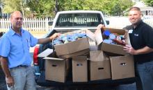 Dan Wolfe and Barry Schneck with a portion of the food collected from Richland Manor's food drive