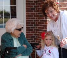 The littlest fish caught, great-grandmother Mary Huffer (of Maple Crest) with grandmother Deb Metzger (Mary^aEURTMs daughter) and Karlie Lora with the littlest fish.