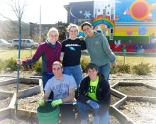 Taking a break in the Chicago urban garden they helped prepare for planting season are Bluffton University students (top, from left) Abbey Graber, Jodi Stutzman and Abbie Richer, along with (bottom, from left) Derek Davis and Tobin Eicher.